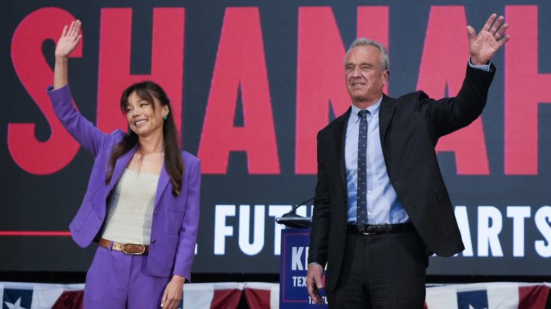 Presidential candidate Robert F. Kennedy Jr. right, waves on stage with Nicole Shanahan, after announcing her as his running mate, during a campaign event, Tuesday, March 26, 2024, in Oakland, Calif. (AP Photo/Eric Risberg)