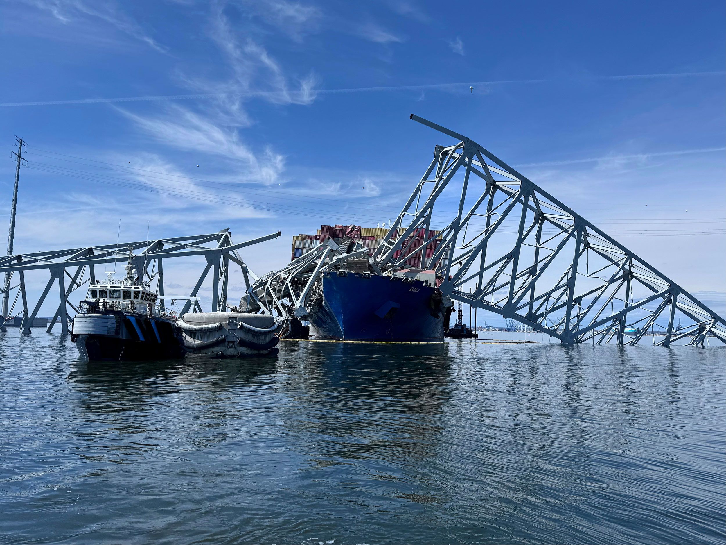 Remnants of the Francis Scott Key Bridge in Baltimore are seen Sunday. Crews have embarked on the complicated operation of removing thousands of tons of steel and concrete.