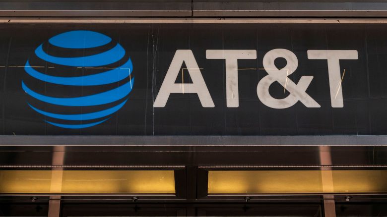 People are passing by an AT&T Inc store in Manhattan, New York City in the US with the company's logo and inscription visible. AT&T Inc. the American Telephone and Telegraph Company is an American multinational telecommunications holding company headquartered at Whitacre Tower in Downtown Dallas, USA. As of March 2024 there was a data breach with leaks of personal data of 73 million customers in the dark web according to the media. NYC, United States of America on May 2023 (Photo by Nicolas Economou/NurPhoto via AP)