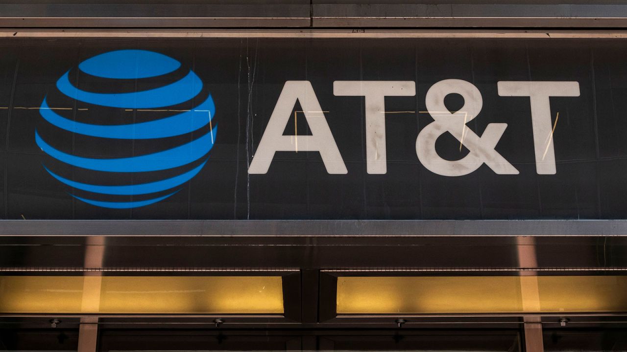 People are passing by an AT&T Inc store in Manhattan, New York City in the US with the company's logo and inscription visible. AT&T Inc. the American Telephone and Telegraph Company is an American multinational telecommunications holding company headquartered at Whitacre Tower in Downtown Dallas, USA. As of March 2024 there was a data breach with leaks of personal data of 73 million customers in the dark web according to the media. NYC, United States of America on May 2023 (Photo by Nicolas Economou/NurPhoto via AP)