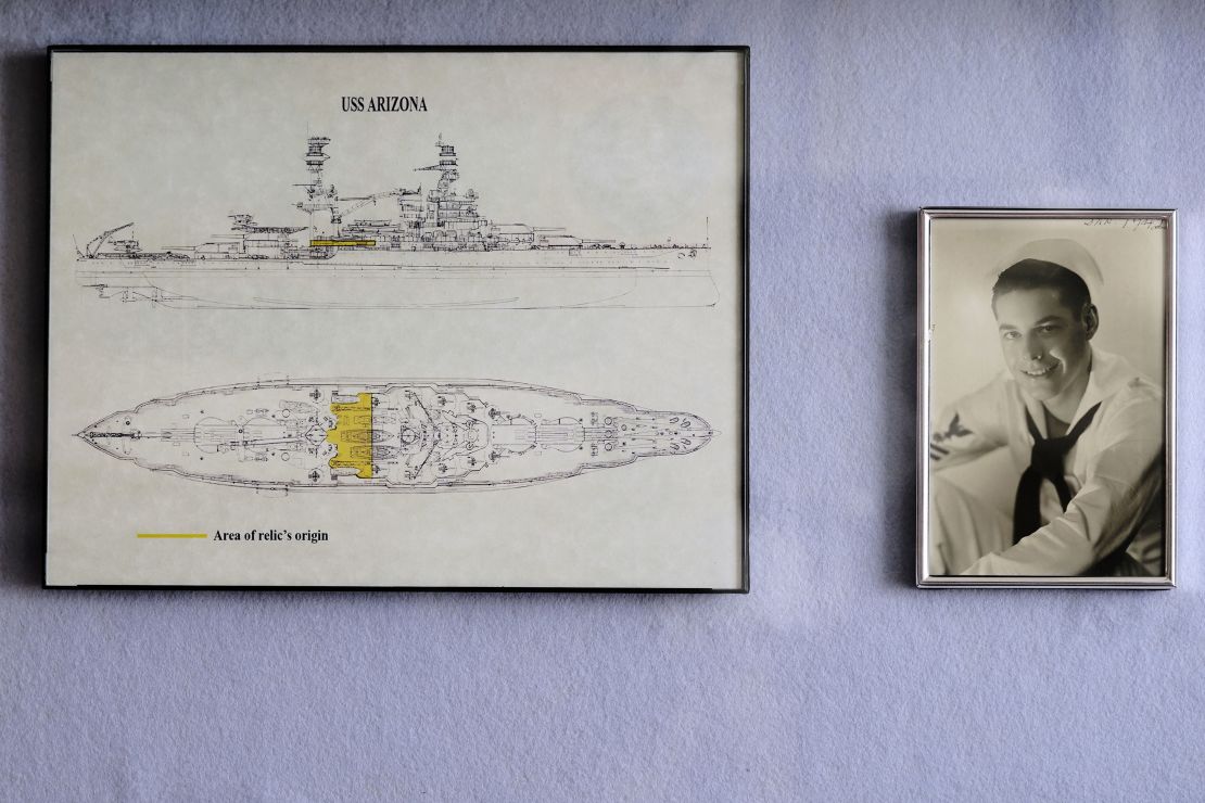 A photo of Pearl Harbor survivor Lou Conter, as seen as a young sailor, is displayed at his home.