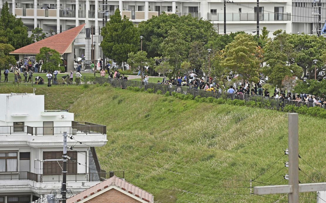 People evacuate to higher ground in Naha, Okinawa after a tsunami warning following a powerful earthquake in Taiwan on April 3, 2024.