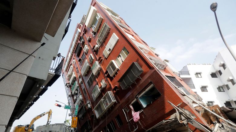 Debris surrounds a titled building a day after a powerful earthquake struck in Hualien City, eastern Taiwan, Thursday, April 4, 2024.