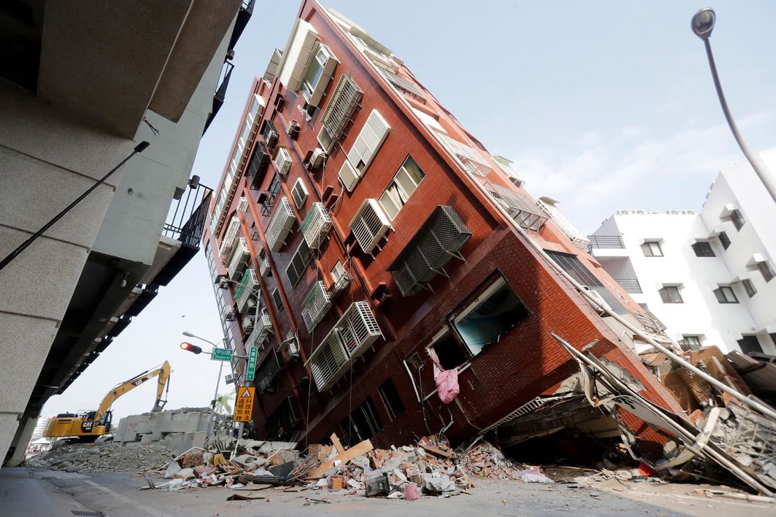 Debris surrounds a titled building a day after a powerful earthquake struck in Hualien City, eastern Taiwan, Thursday, April 4, 2024.