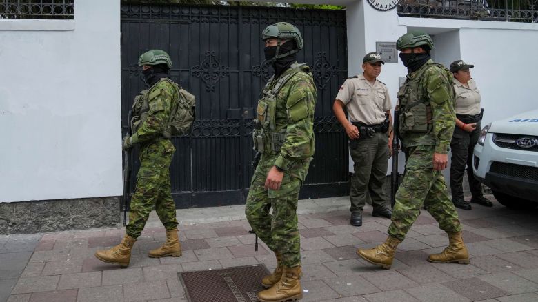 Soldiers and police stand guard outside the Mexican embassy, in Quito, Ecuador, Friday, April 5, 2024.