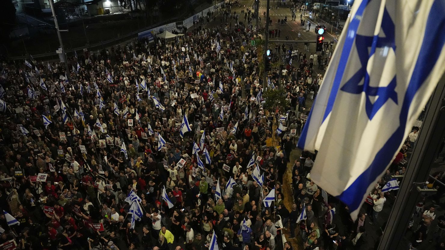 People take part in a protest against Israeli Prime Minister Benjamin Netanyahu's government and call for the release of hostages held in the Gaza Strip by the Hamas militant group in Tel Aviv, Israel, Saturday, April 6, 2024.