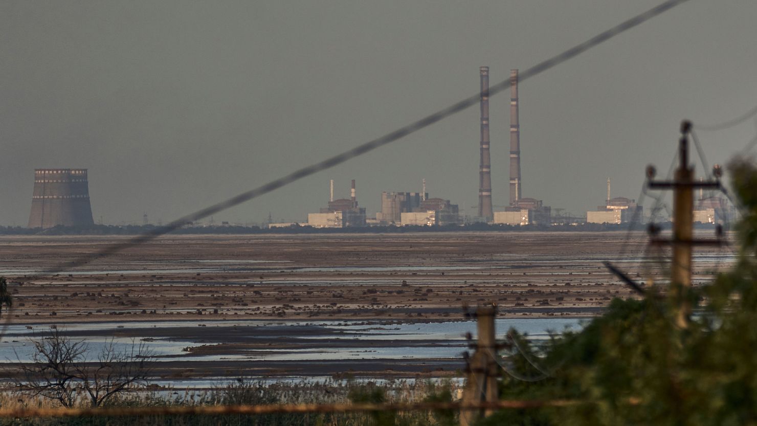 A 2023 file photo of Zaporizhzhia nuclear power plant, Europe's largest, is seen in the background of the shallow Kakhovka Reservoir.