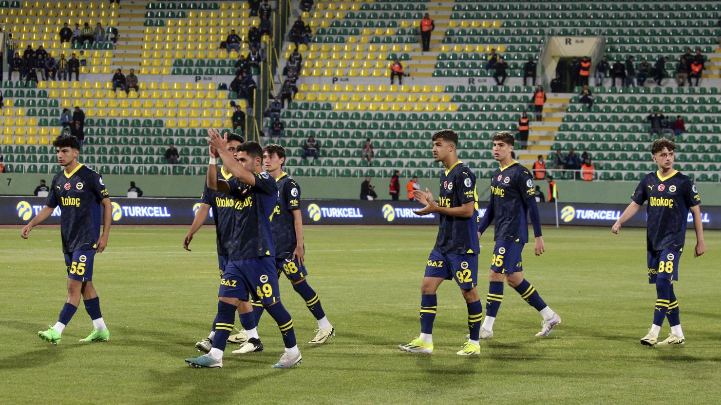 Fenerbahce players walk off the pitch during the Super Cup final.