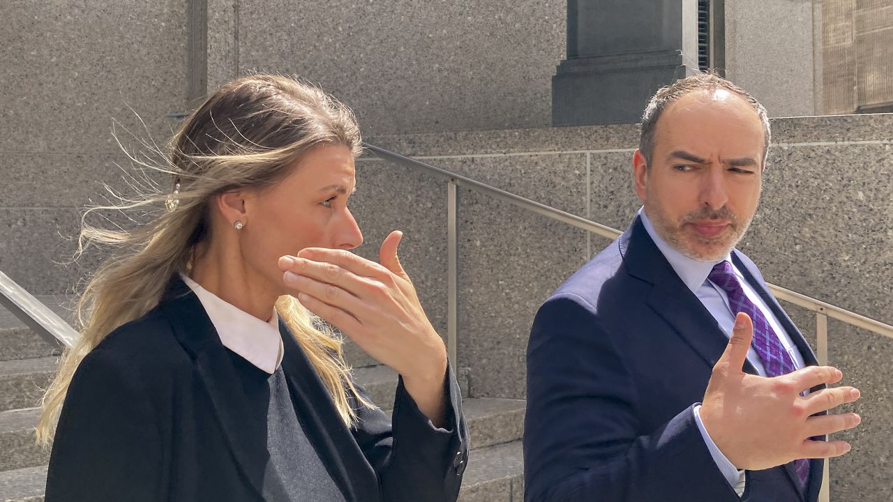 Aimee Harris, left, walks out of Manhattan federal court, Tuesday, April 9, 2024, in New York. The Florida mother has been sentenced to a month in prison and three months of home confinement for stealing and selling President Joe Biden's daughter's diary four years ago.