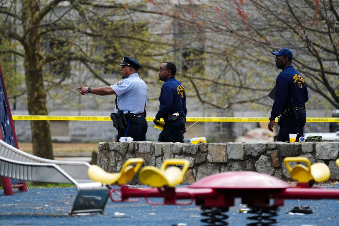 Investigators seen at the scene of the shooting on April 10, 2024.