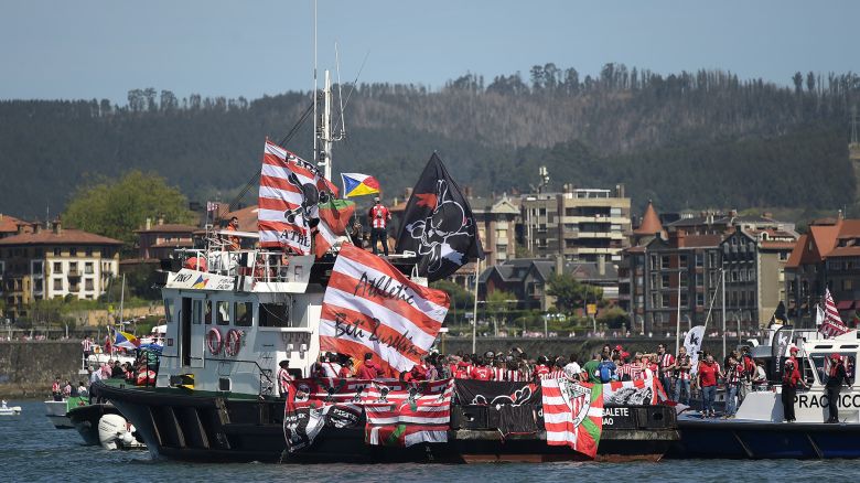 Athletic Bilbao fans on various boats prepare to join the team celebrating after winning the final of the Copa del Rey on the 'Gabarra', an old industrial barge on the Nervion Estuary in Bilbao, Spain.