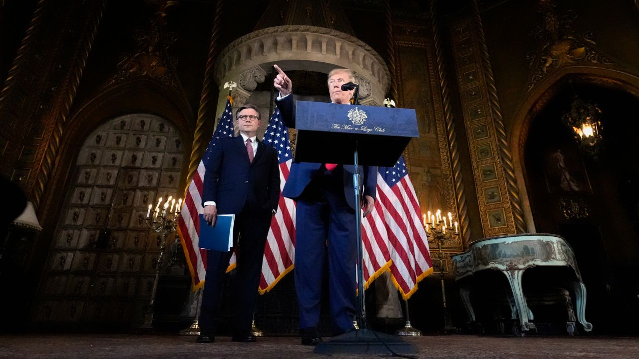 President-elect Donald Trump speaks as House Speaker Mike Johnson listens during a news conference at Mar-a-Lago in Palm Beach, Florida, on April 12, 2024.
