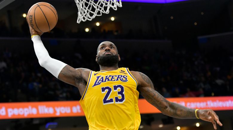 Los Angeles Lakers forward LeBron James (23) dunks in the second half of an NBA basketball game against the Memphis Grizzlies Friday, April 12, 2024, in Memphis, Tenn.