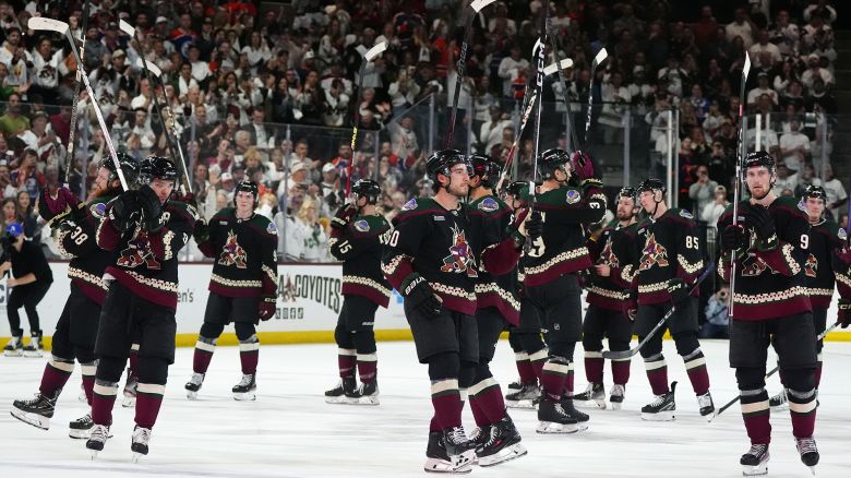 Arizona Coyotes players acknowledge the fans after an NHL hockey game against the Edmonton Oilers on Wednesday, April 17, 2024, in Tempe, Ariz. The Coyotes won 5-2. Team owner Alex Meruelo agreed to sell franchise's hockey operations to Utah Jazz owner Ryan Smith, who intends to move the team to Salt Lake City. (AP Photo/Ross D. Franklin)