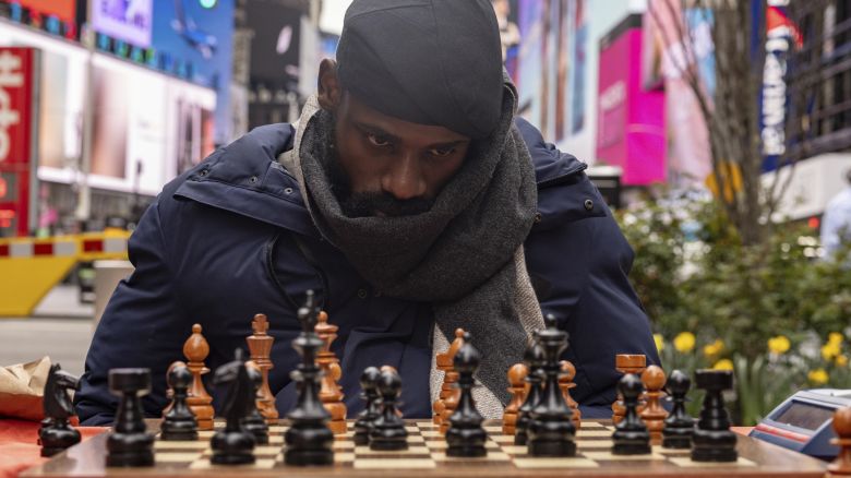 Tunde Onakoya, a Nigerian chess champion and child education advocate, plays a chess game in Times Square, Friday, April 19, 2024, in New York.