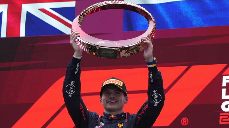 Red Bull driver Max Verstappen celebrates on the podium after winning the Chinese Grand Prix.
