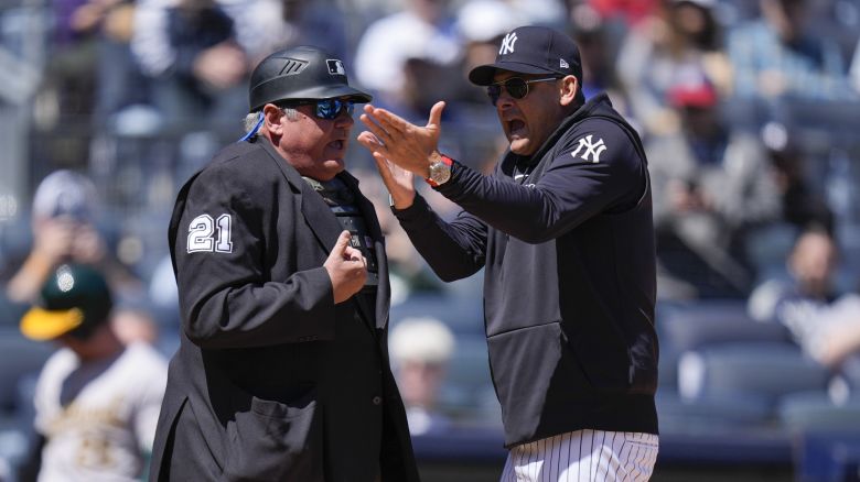New York Yankees manager Aaron Boone, right, argues with umpire Hunter Wendelstedt during the first inning of the baseball game against the Oakland Athletics at Yankee Stadium Monday, April 22, 2024, in New York. Boone was ejected from the game. (AP Photo/Seth Wenig)