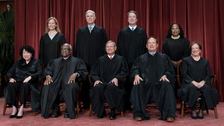 FILE - Members of the Supreme Court sit for a new group portrait following the addition of Associate Justice Ketanji Brown Jackson, at the Supreme Court building in Washington, on Oct. 7, 2022. Bottom row, from left, Associate Justice Sonia Sotomayor, Associate Justice Clarence Thomas, Chief Justice of the United States John Roberts, Associate Justice Samuel Alito, and Associate Justice Elena Kagan. Top row, from left, Associate Justice Amy Coney Barrett, Associate Justice Neil Gorsuch, Associate Justice Brett Kavanaugh, and Associate Justice Ketanji Brown Jackson. The core issue being debated before the Supreme Court on April 25, 2024, boils down to this: Whether a former president is immune from prosecution for actions taken while in office — and, if so, what is the extent of the immunity? (AP Photo/J. Scott Applewhite)