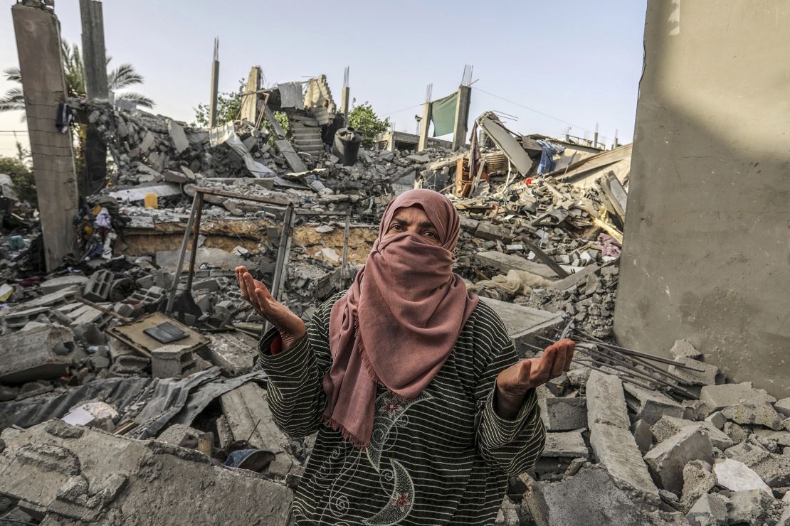 A Palestinian woman inspects a house that was destroyed by Israeli bombing in Rafah, in the south of the Gaza Strip, on Wednesday.