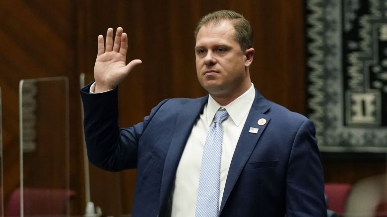FILE - Arizona Rep. Jake Hoffman, R-Queen Creek, is sworn in during the opening of the Legislature at the state Capitol,  Jan. 11, 2021, in Phoenix. Hoffman is one of 11 Republicans in Arizona who submitted a document to Congress falsely declaring Donald Trump had beaten Joe Biden in the state during the 2020 presidential election were charged Wednesday, April 24, 2024, with conspiracy, fraud and forgery, marking the fourth state to bring charges against "fake electors." (AP Photo/Ross D. Franklin, Pool, File)