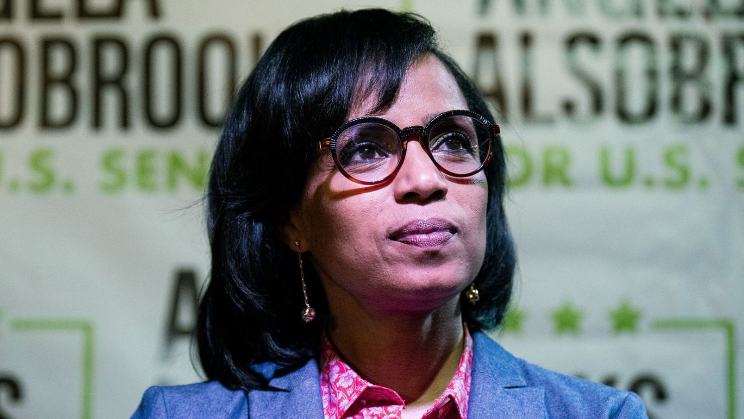 Angela Alsobrooks listens as local officials speak during her "All in for Angela" campaign event at McGinty's Public House restaurant in Silver Spring on April 24, 2024.