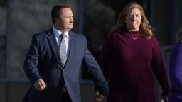 FILE - Paramedic Jeremy Cooper, left, enters the Adams County, Colo., Justice Center, Dec. 22, 2023, in Brighton, Colo. The former Aurora Fire Department paramedic faces up to three years in prison when he is scheduled to be sentenced Friday, April 26, 2024, for criminally negligent homicide in Elijah McClain's death. (AP Photo/David Zalubowski, File)