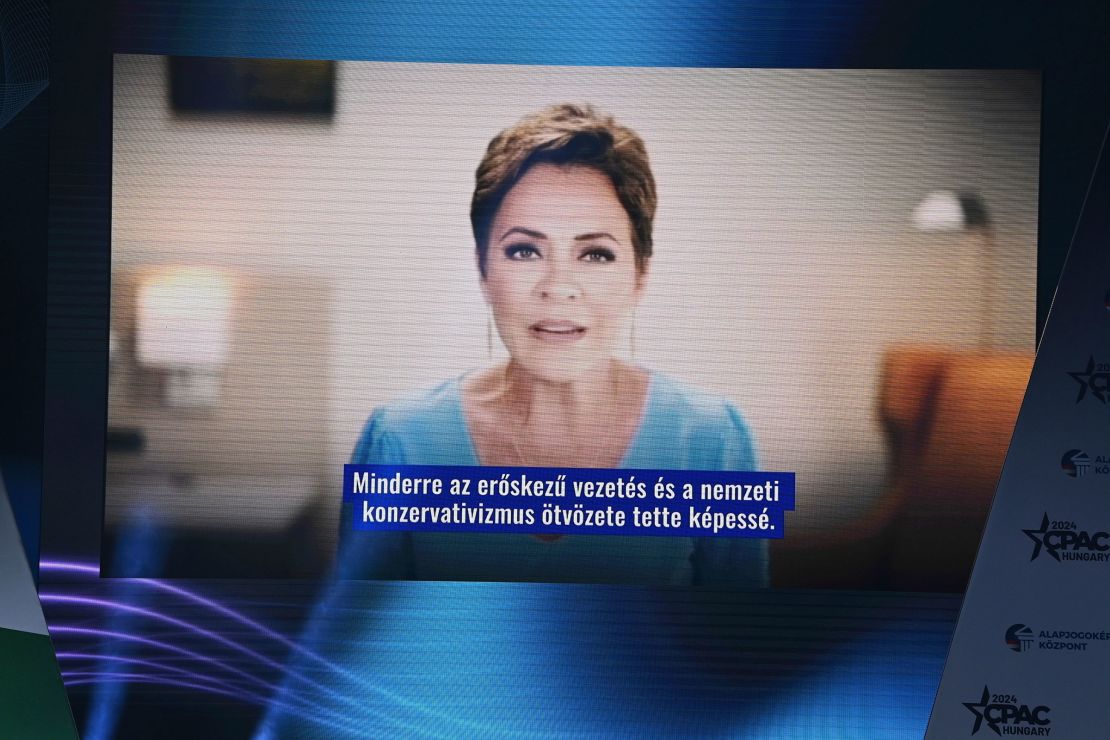 A video or American politician Kari Lake is played, with subtitles in a non-English language. 