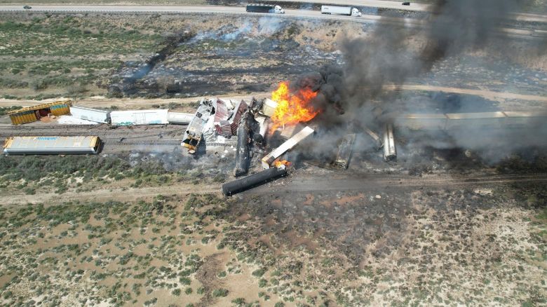 In this photo provided by David Yellowhorse, a freight train carrying fuel derailed and caught fire, Friday, April 26, 2024, east of Lupton, Ariz., near the New Mexico-Arizona state line. Authorities closed Interstate 40 in both directions in the area, directing trucks and motorists to alternate routes.