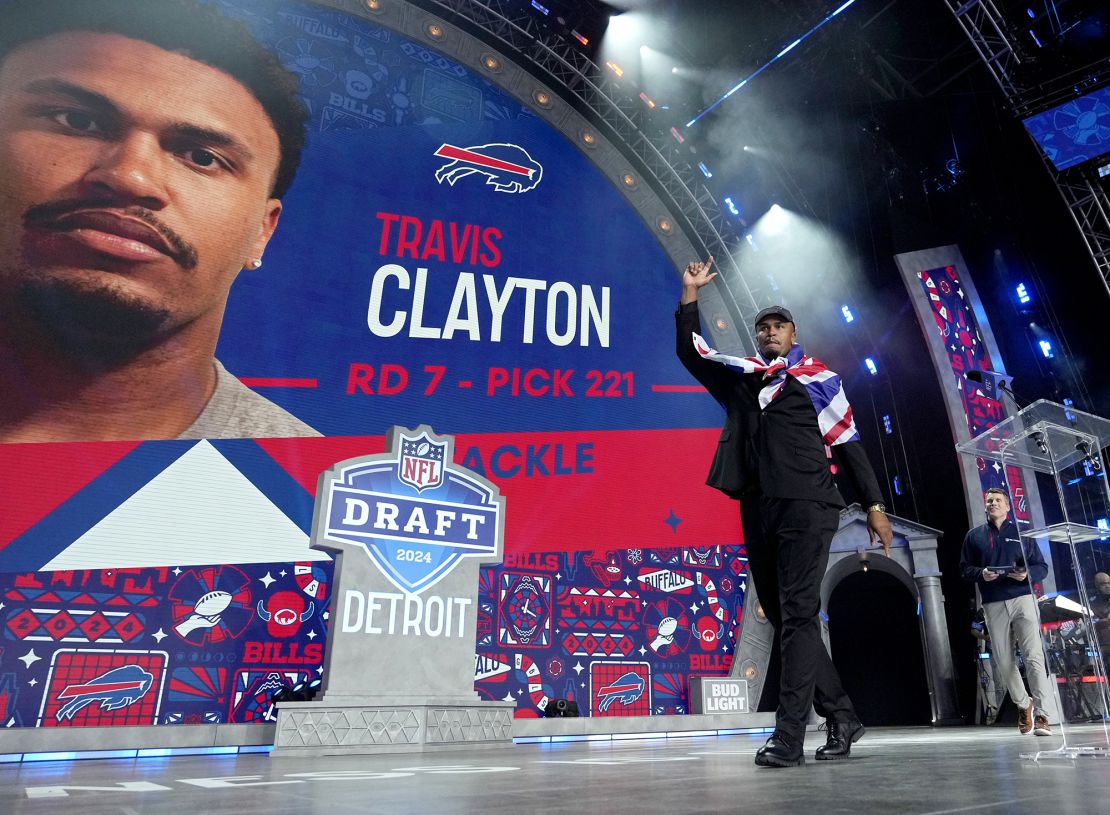Clayton wears a United Kingdon flag on his shoulders on stage after being drafted by the Bills.