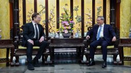 In this photo released by Xinhua News Agency, visiting Tesla founder and CEO Elon Musk, left, meets with Chinese Premier Li Qiang in Beijing, Sunday, April 28, 2024.