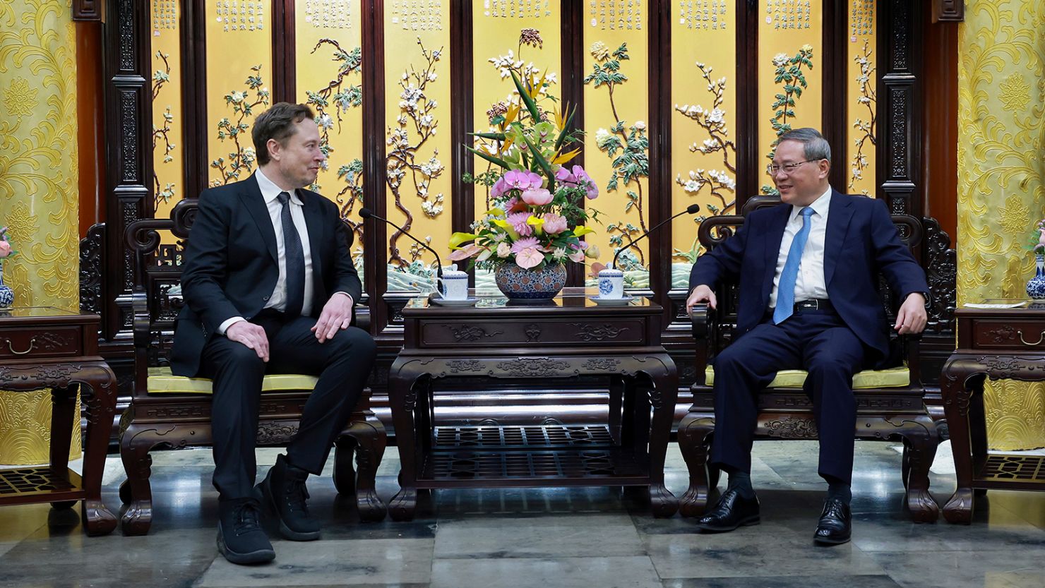 Tesla CEO Elon Musk, left, met with Chinese Premier Li Qiang in Beijing on Sunday, April 28, 2024.
