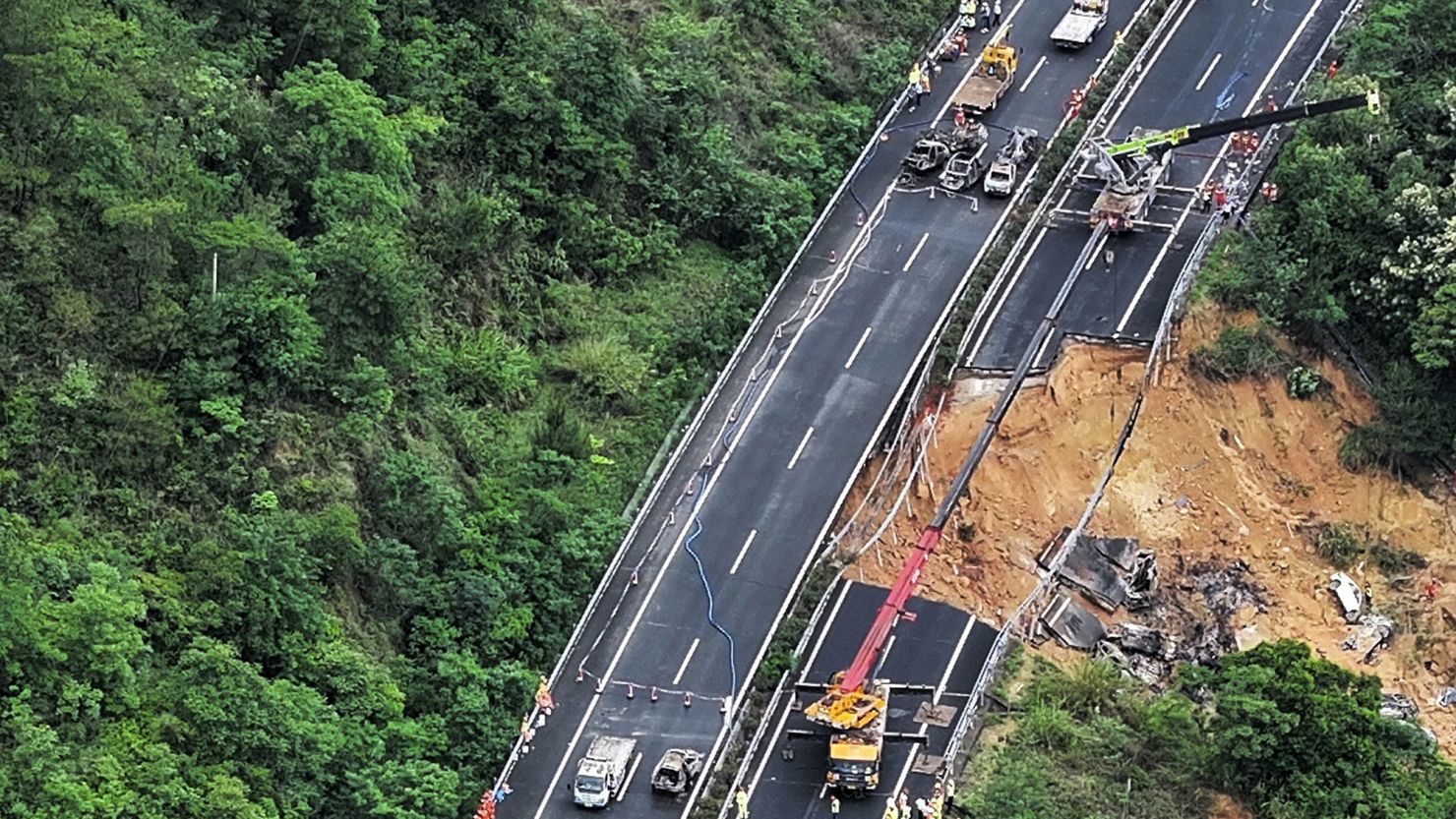 Rescuers work at a collapsed section of the Meizhou-Dabu Expressway in China's Guangdong province on May 1, 2024.