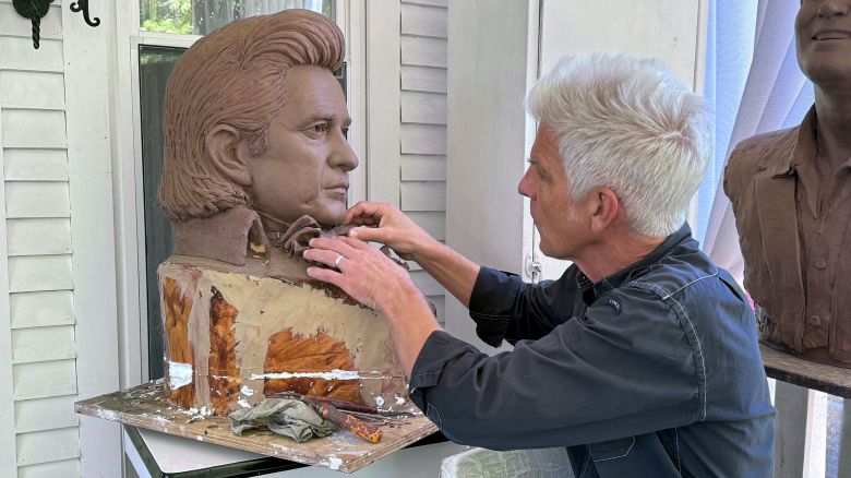Artist Kevin Kresse, works on a clay bust of Johnny Cash, April 23, 2024 in Little Rock, Ark. Kresse's full sculpture of Cash will be unveiled at the U.S. Capitol as part of the Statuary Hall collection, later this year. (AP Photo/Mike Pesoli) 