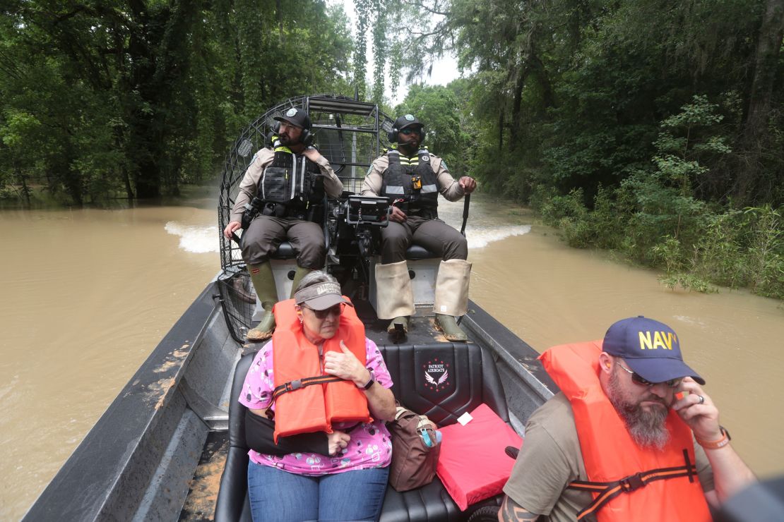 Texas Parks and Wildlife Department officers used boats to rescue residents from floodwaters.