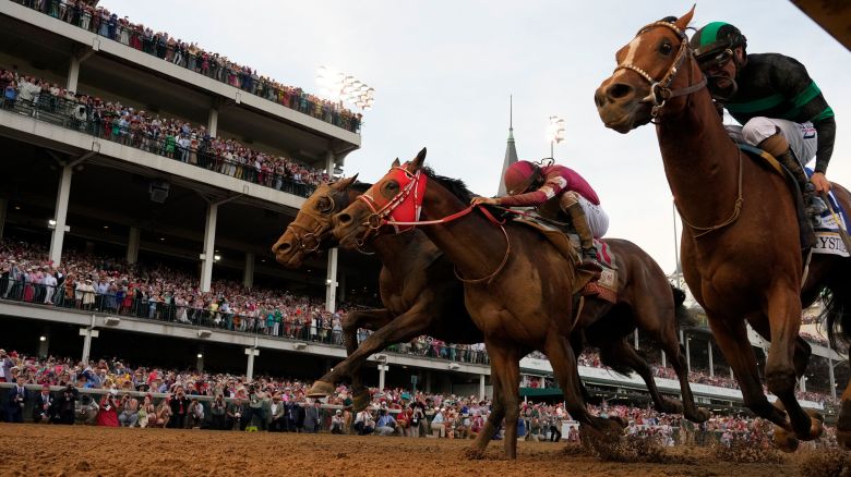 Brian Hernandez Jr. rides Mystik Dan, right, runs to the finish line to win the 150th running of the Kentucky Derby horse race at Churchill Downs Saturday, May 4, 2024, in Louisville, Ky. (AP Photo/Jeff Roberson)