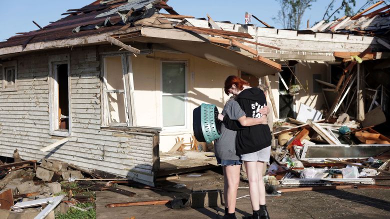 Joy King, left, and her granddaughter Crystal Maxey hug in front of King's house that was destroyed by a tornado Tuesday, May 7, 2024 in Barnsdall, Oklahoma. The two were looking for King's cats and salvaging what items they could.
