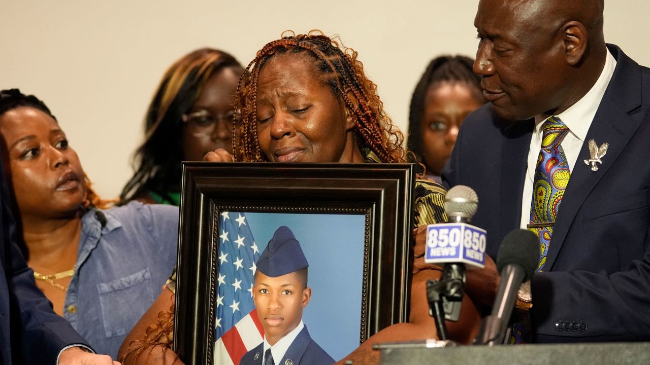 Chantimek Fortson, mother of U.S. Naval Aviator Roger Fortson, holds a photo of her son during a press conference about his death with attorney Ben Crump (right) on Thursday, May 9, 2024 in Fortson. photographing. Fortson, of Walton Beach, Florida, was shot and killed by police in his apartment on May 3, 2024. (AP Photo/Gerald Herbert)