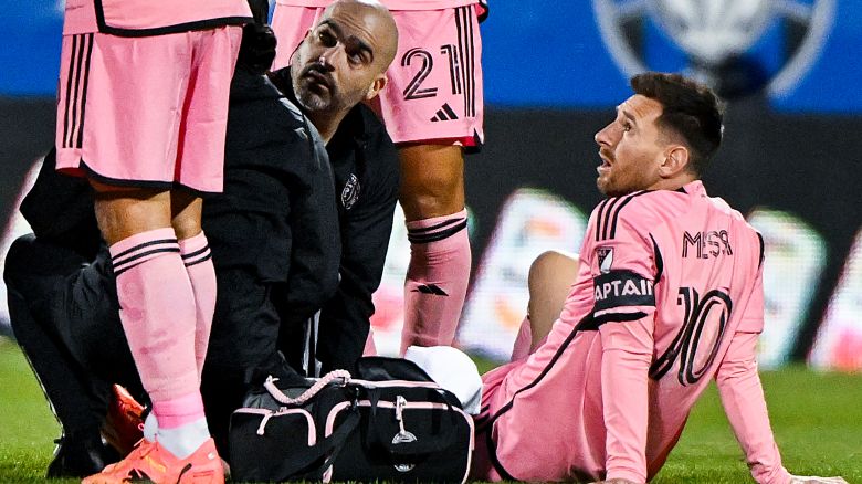 Inter Miami's Lionel Messi is tended to by team trainers during the first half of the team's MLS soccer match against CF Montreal in Montreal, Saturday, May 11, 2024.