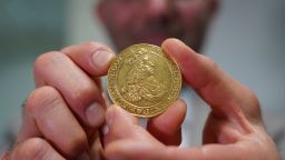 Vicken Yegparian, vice president of numismatics, Stack's Bowers Galleries, holds a golden coin once belonging to the collection of Danish king, Frederik VII, now part of L. E. Bruun's collection, in Zealand, Denmark, May 7, 2024.