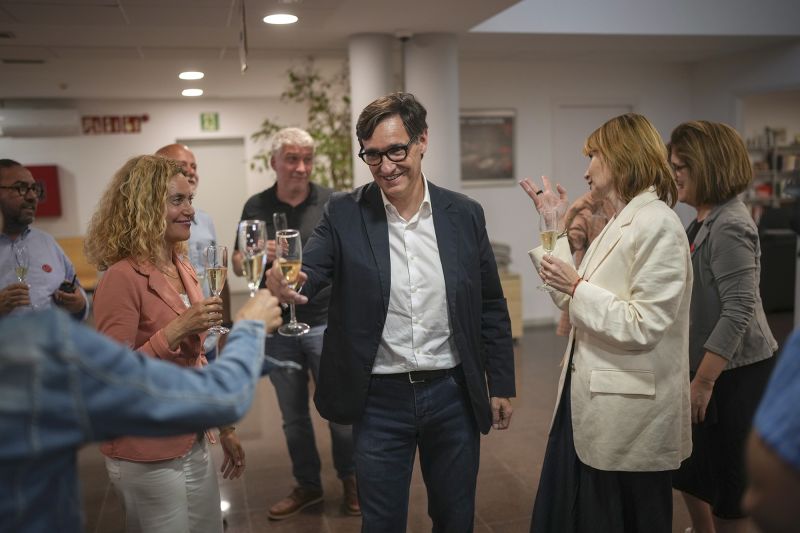 Socialist candidate Salvador Illa makes a toast with members of his team and party colleagues after the announcement of the results of the elections.