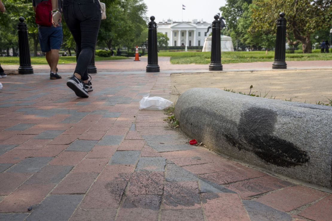 Tire tracks remain on a curb in Lafayette Square Park, near the White House, May 23, 2023, in Washington. Sai Varshith Kandula was sentenced to prison on Thursday, January 16, 2025, after pleading guilty to crashing a rental truck into the White House barriers in 2023.