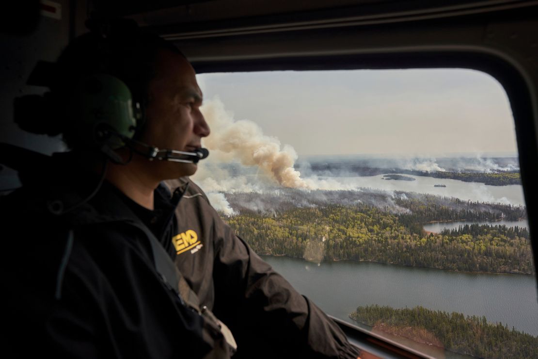 Manitoba Premier Wab Kinew surveys wildfires burning in northern Manitoba on May 14, 2024.