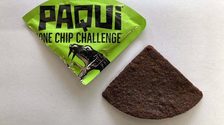 A Paqui One Chip Challenge chip is displayed in Boston, Friday, Sept. 8, 2023. A medical examiner says a Massachusetts teen who participated in a spicy tortilla chip challenge died from ingesting a substance “with a high capsaicin concentration,” according to autopsy results The Associated Press obtained late Wednesday, May 15, 2024. Capsaicin is a chili pepper extract. Harris Wolobah died on Sept. 1, 2023, after eating the chip.