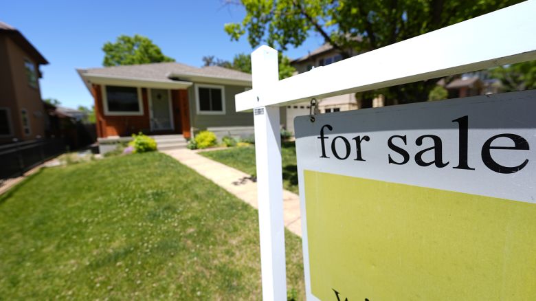 A for sale sign stands outside a single-family residence on the market Wednesday, May 22, 2024, in southeast Denver.