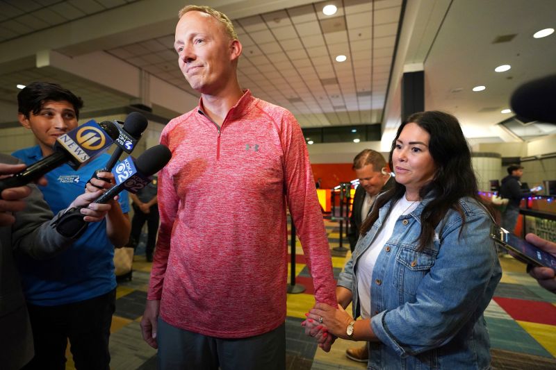 Bryan Hagerich, with his wife, Ashley, after arriving at Pittsburgh International Airport on Friday.