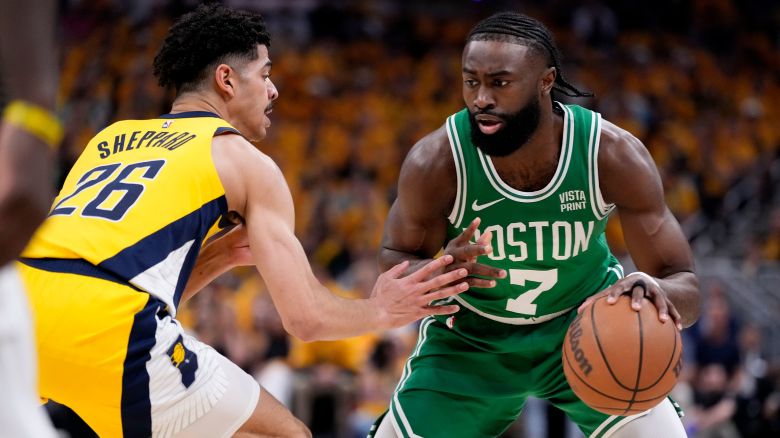 Boston Celtics guard Jaylen Brown (7) drives around Indiana Pacers guard Ben Sheppard (26) during the first half of Game 3 of the NBA Eastern Conference basketball finals, Saturday, May 25, 2024, in Indianapolis. (AP Photo/Michael Conroy)