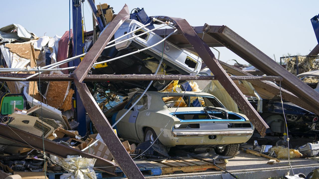 Vehicles in a body shop are seen amid debris the morning after a tornado rolled through, Sunday, May 26, 2024, in Valley View, Texas. Powerful storms left a wide trail of destruction Sunday across Texas, Oklahoma and Arkansas after obliterating homes and destroying a truck stop where drivers took shelter during the latest deadly weather to strike the central U.S.