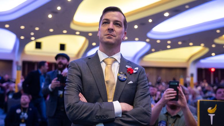 Libertarian presidential candidate Chase Oliver watches as the results of the sixth round of voting to elect the Libertarian Party's 2024 presidential nominee are announced during the Libertarian National Convention at the Washington Hilton in Washington, D.C., May 26, 2024.