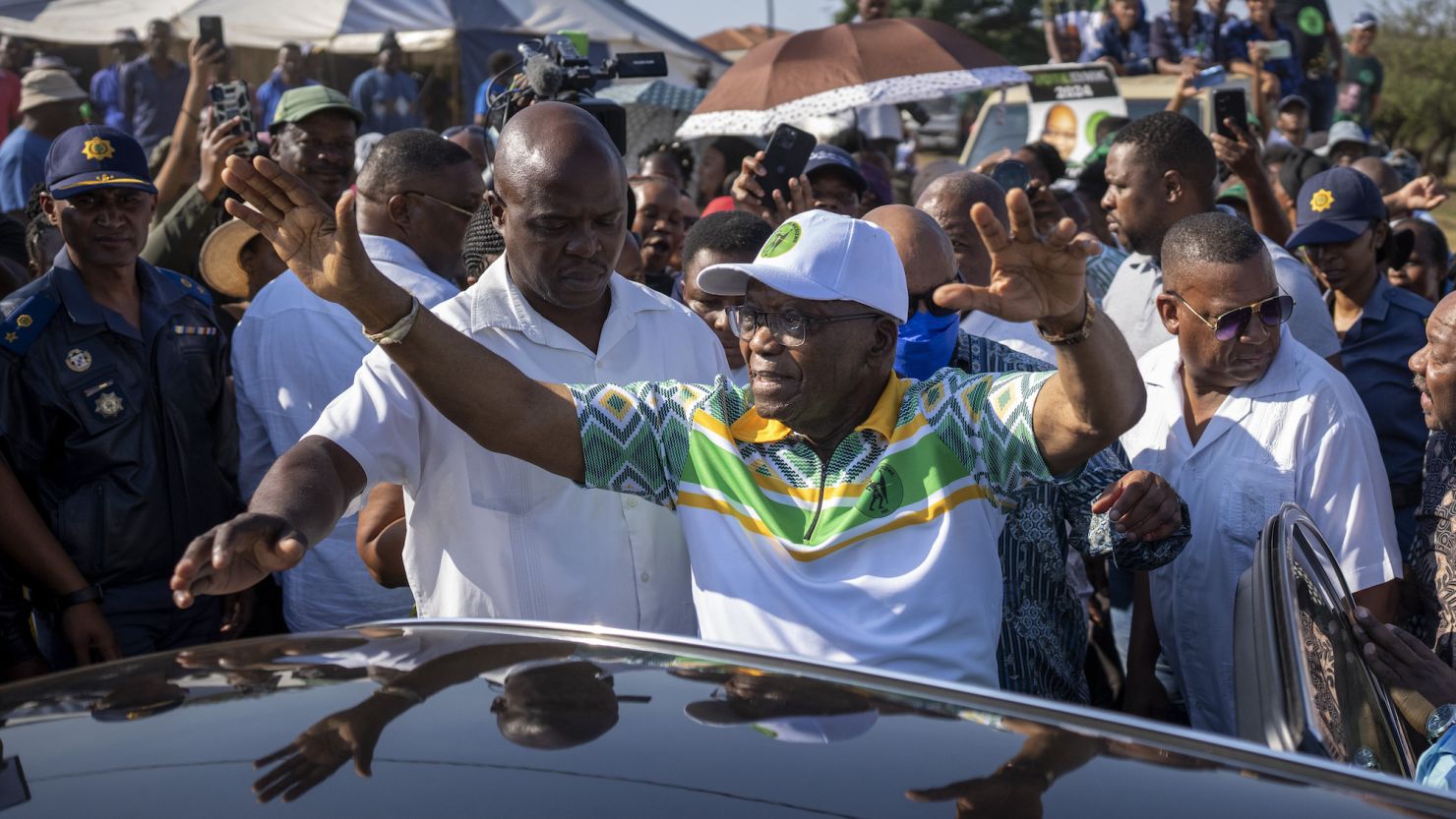 Former president of the ANC and South Africa Jacob Zuma, waves to supporters after casting his ballot on May 29 during general elections in Nkandla, Kwazulu Natal, South Africa.