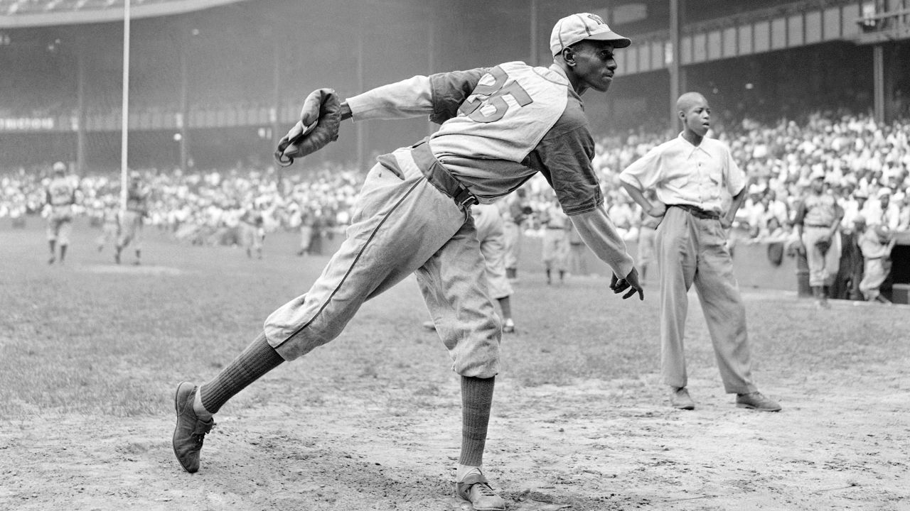 In this Aug. 2, 1942, file photo, Kansas City Monarchs pitcher Leroy Satchel Paige warms up at New York's Yankee Stadium before a Negro League game between the Monarchs and the New York Cuban Stars. Major League Baseball said Tuesday, May 28, 2024, that it has incorporated records for more than 2,300 Negro Leagues players following a three-year research project. Paige’s 1.01 ERA for the 1944 Kansas City Monarchs of the Negro American League ranks third since ERA became an official stat in the National League in 1912 and American League in 1913. Paige was also credited with 28 Negro Leagues wins, raising his career total to 125.